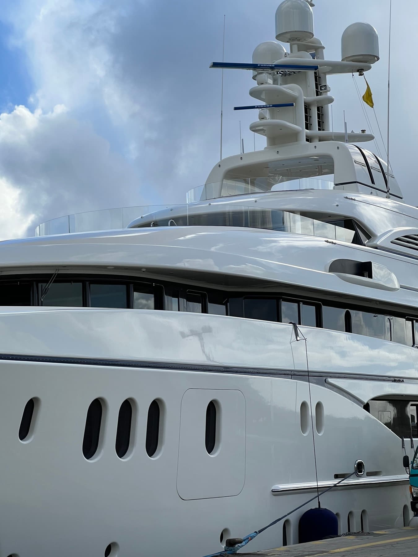Close view of a megayacht’s bridge decks and radar masts