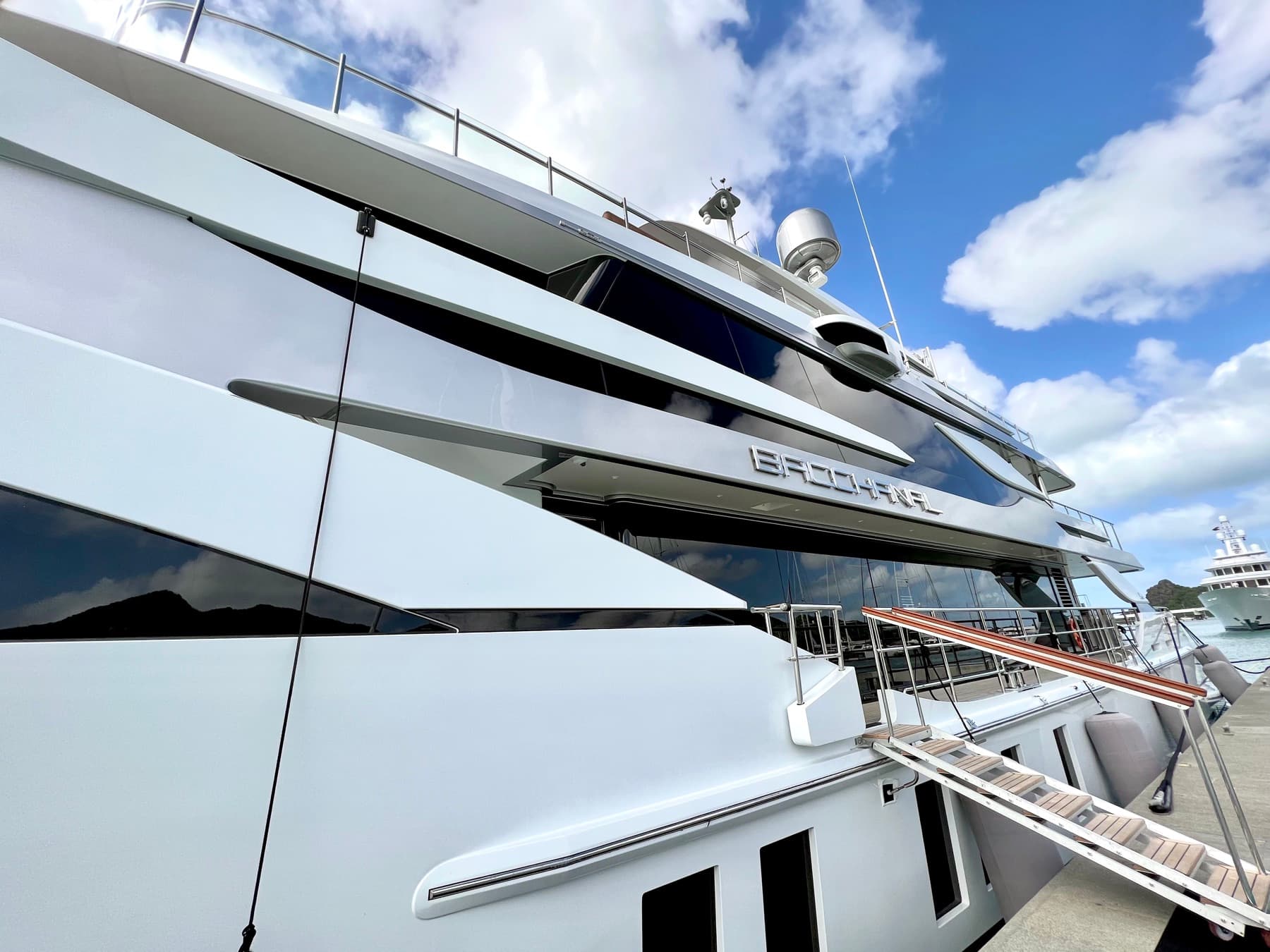 Gangway leading to a large yacht alongside a quay