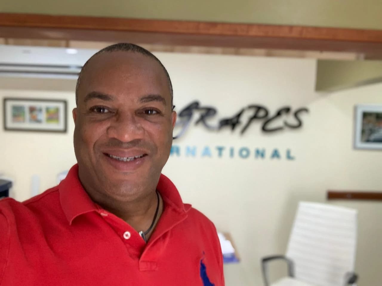 Earl Wyatt in a red polo shirt at the Sea Grapes office